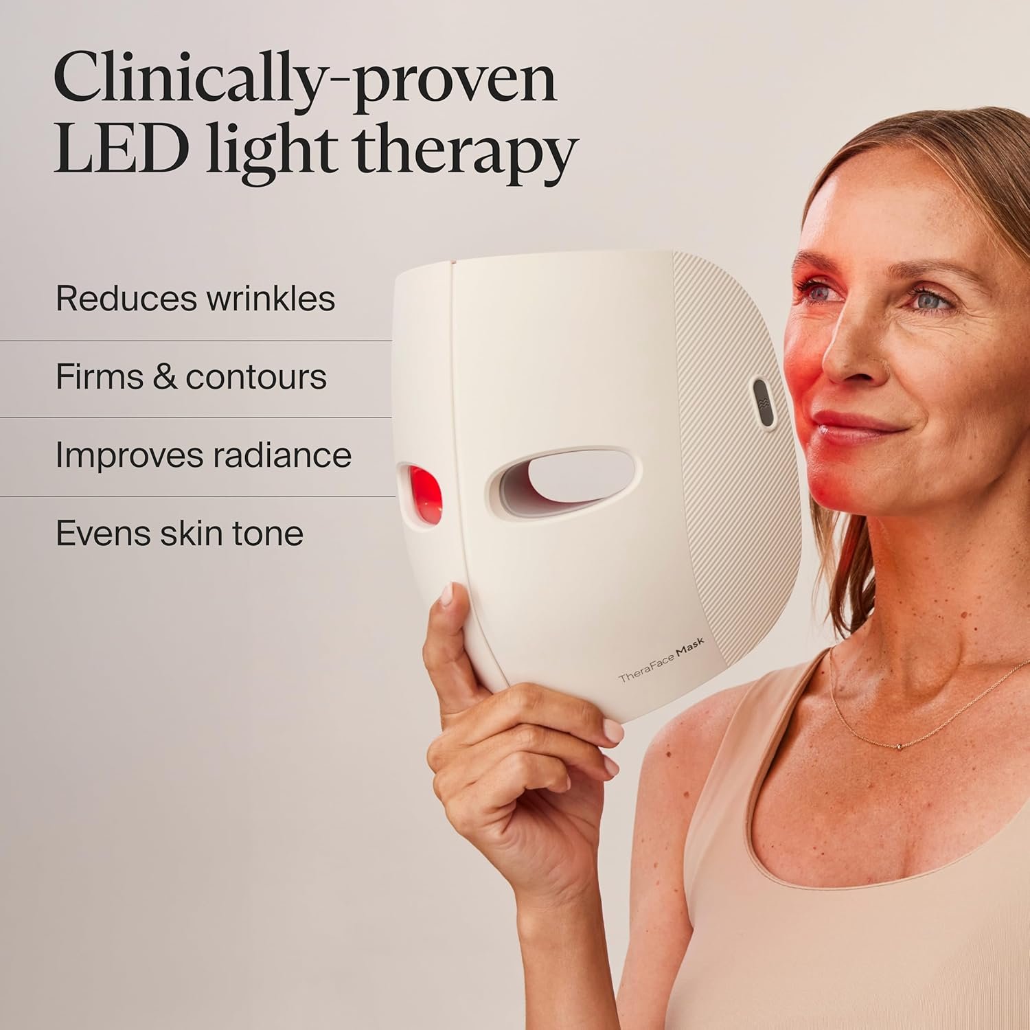 TheraFace LED light therapy mask with blue and red light settings, showing vibrating massage device for anti-aging and dark spot reduction — side