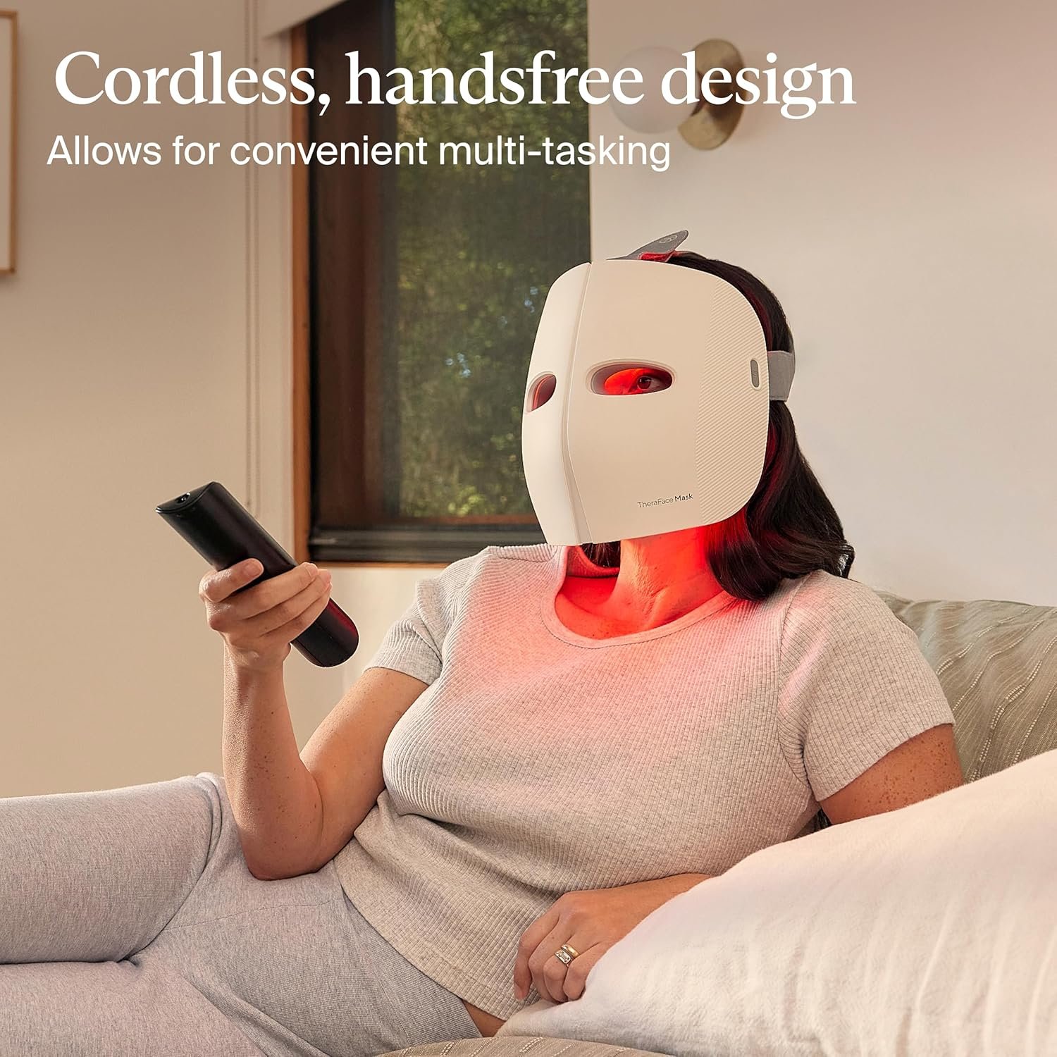 TheraFace LED light therapy mask with blue and red light settings, showing vibrating massage device for anti-aging and dark spot reduction — view 2