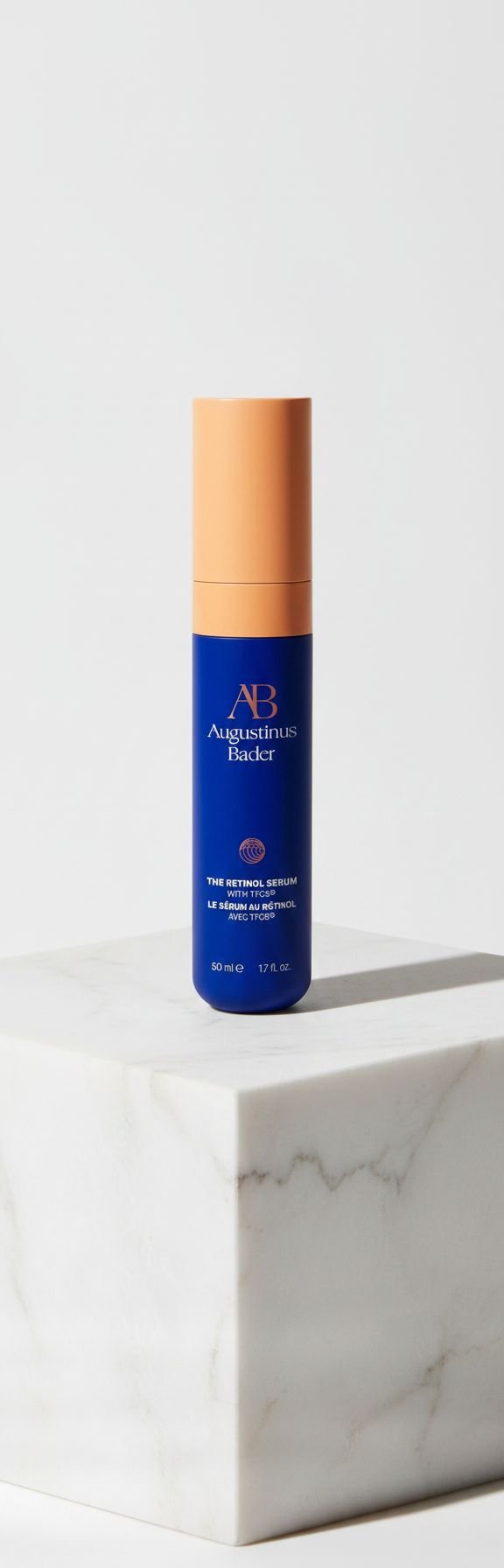 Retinol anti-aging serum bottle with dropper on neutral background, showing hydrating formula for fine lines and firmness — view 1