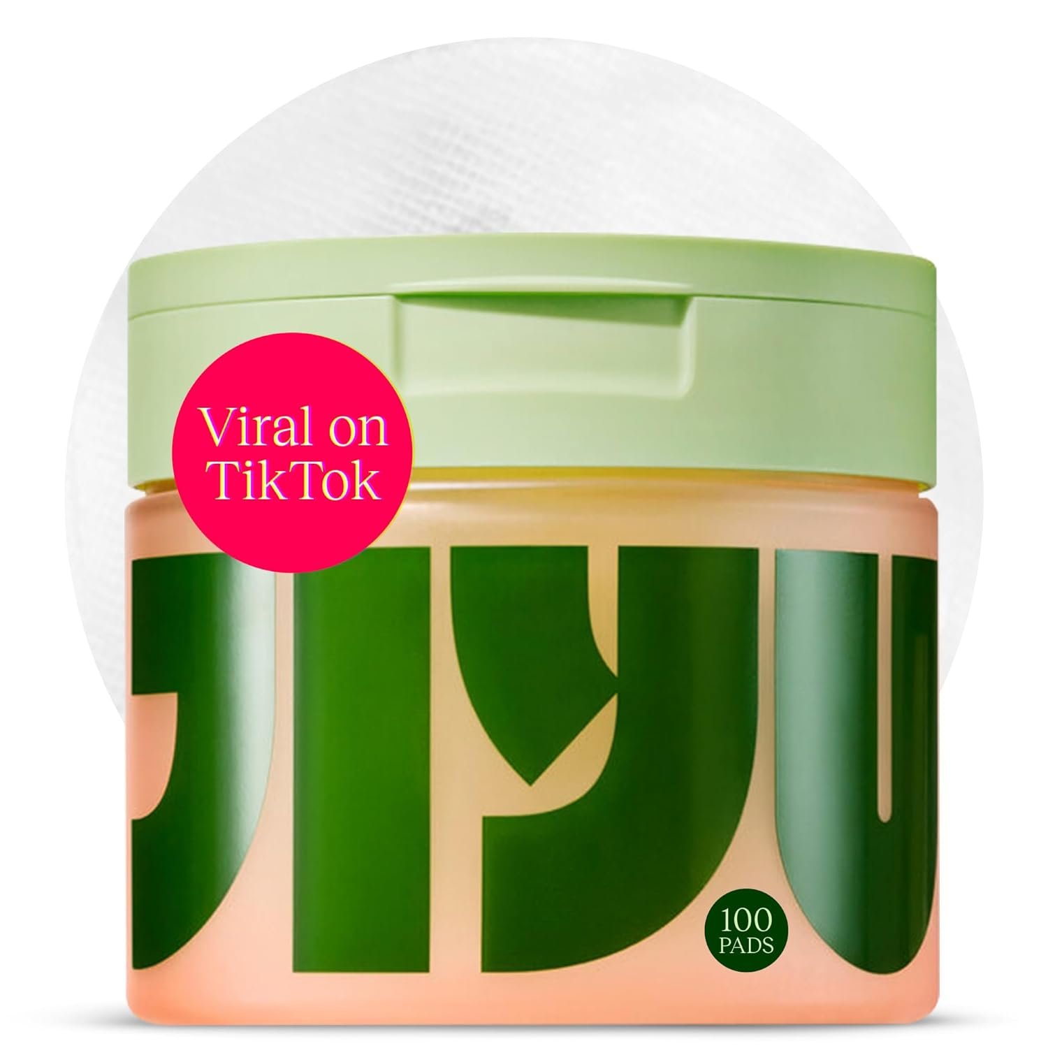 Snail mucin and niacinamide brightening toning pads in glass jar with product swatches on hydrated skin — view 1